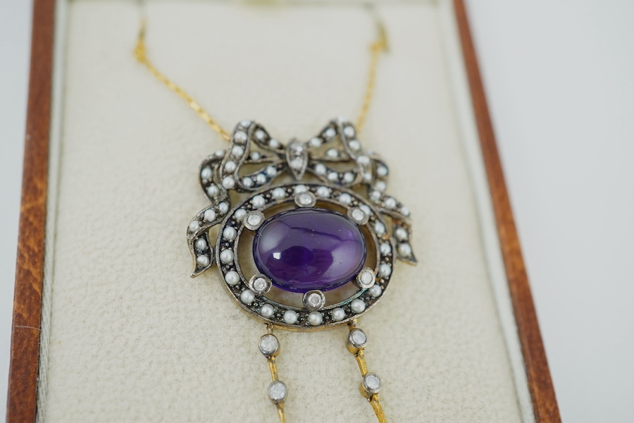 An Edwardian style yellow metal, cabochon amethyst, seed pearl, diamond and cultured pearl double drop pendant, on a 375 chain, pendant 54mm, gross weight 7.5 grams. Condition - fair